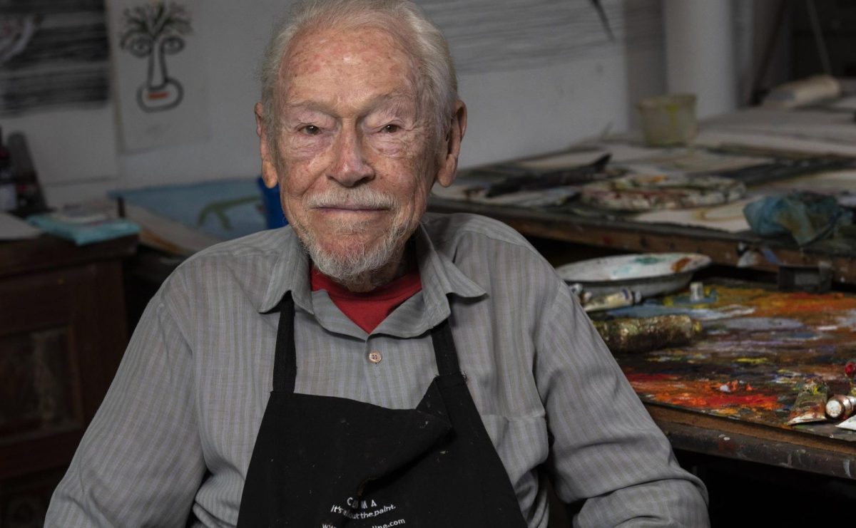 Image of elderly male painter in his studio. Guy Warren