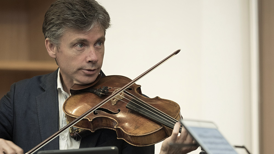 Man playing a viola (head and shoulders shot)