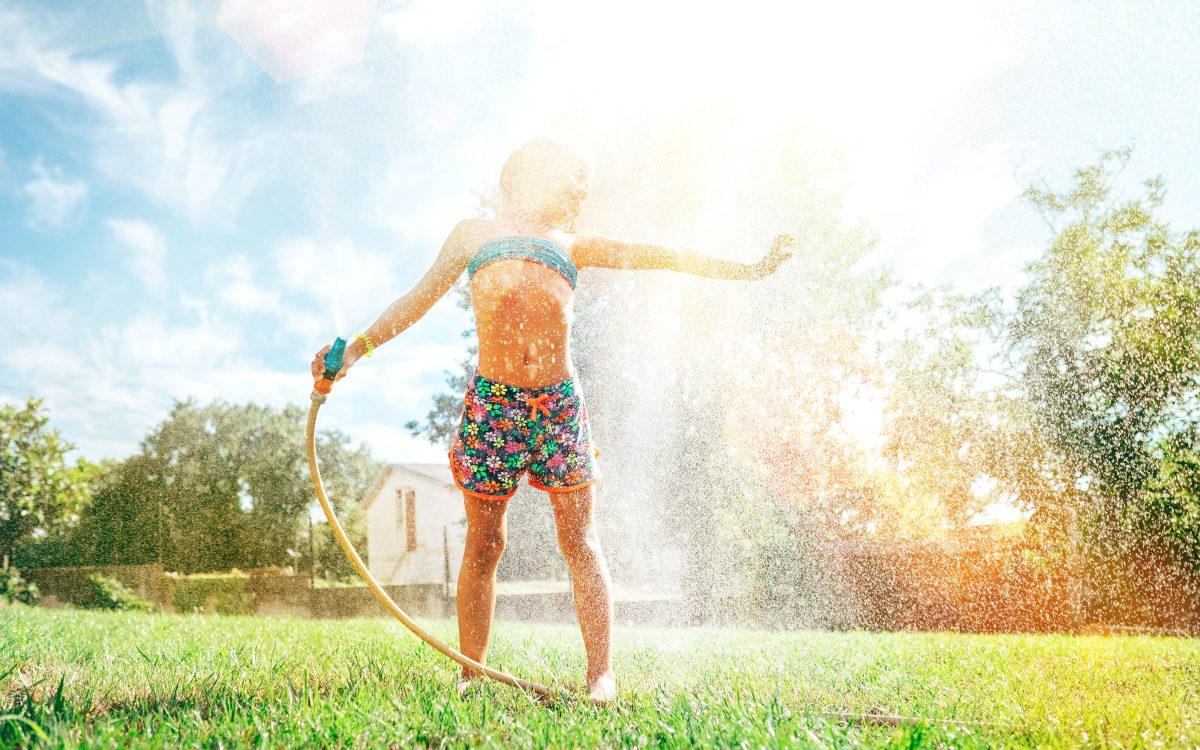 girl under sprinkler