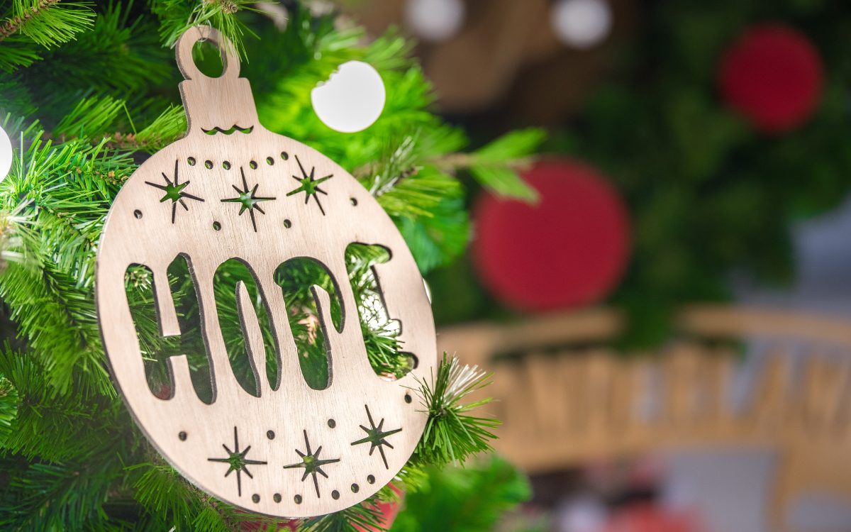 A decoration on a Christmas tree reading Hop.