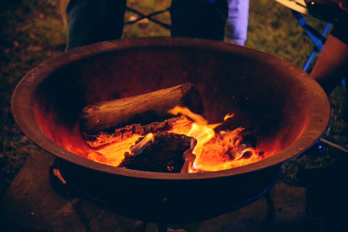 A fire burns in a brazier to warm winter arts-lovers.