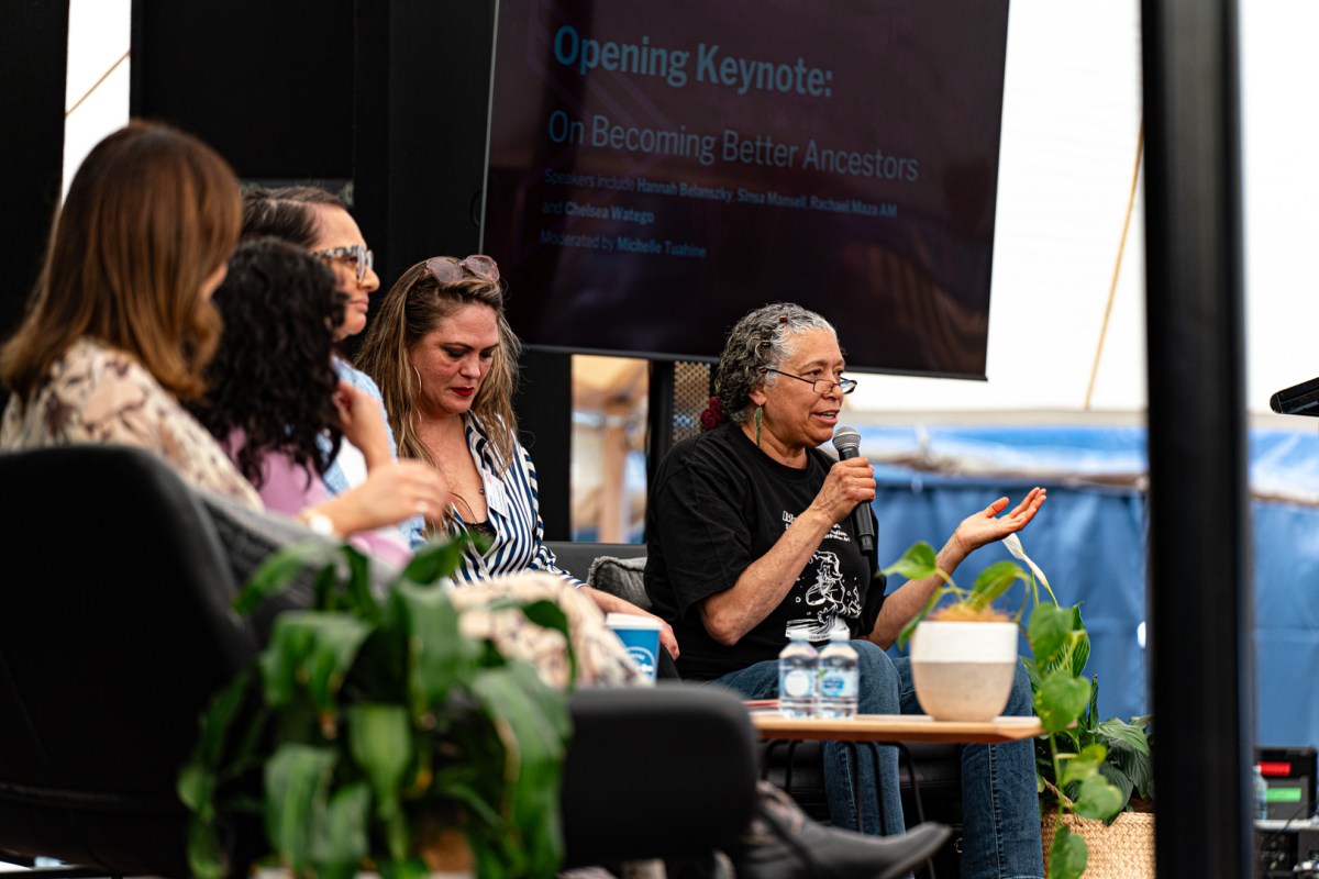 Australian Performing Arts Forum. A panel of five woman sit and address an audience. One with grey hair has a microphone.