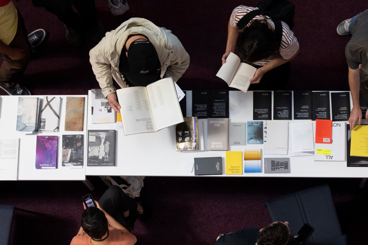 aerial view of people looking at art books