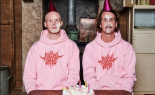 Tow men wearing pink hoodies and cake smudged on their faces. Dowel Jones.