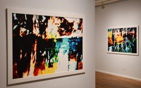 Installation view of 'Ivan Durrant: Marmalade Skies Through Opal Eyes' at Hamilton Gallery. L to R: 'Cavendish', 2023, and 'Murray River', 2021. Photo: Supplied. Two paintings showing blurry riverscapes with bright colours, seemingly drawn from a photograph.