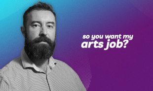 A man with a pale shirt and a beard is standing against a bluey-purply background with the words 'So you want my arts job' against it.