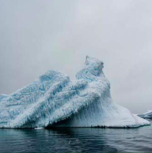 Photograph of an iceberg.