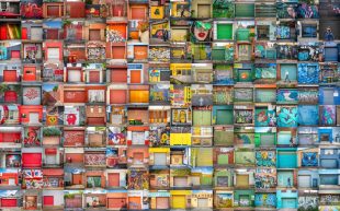 ‘Garage Doors’ by Ruth Woodrow, finalist of 2023 Head On Photo Awards, Landscape Category. A collaged photo of different colourful garage doors arranged in a rainbow spectrum.