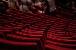 A theatre with empty seats, positioned here to denote the Australian theatre industry and performing arts sustainability.