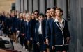 Kirsha Kaechele and supporters, Ladies Lounge Supreme Court of Tasmania Hearing. A group of more than 20 women wearing navy business suits lined up in single file, with Kirsha at the front.