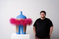 Alfred Lowe and MA Art Prize winning ceramic 'All dressed up I', a large scale blue vessel with a narrow spout and a fluffy pink scarf around it.