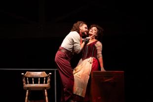 A man has a switchblade against a woman's throat in the production of 'Sweeney Todd.'