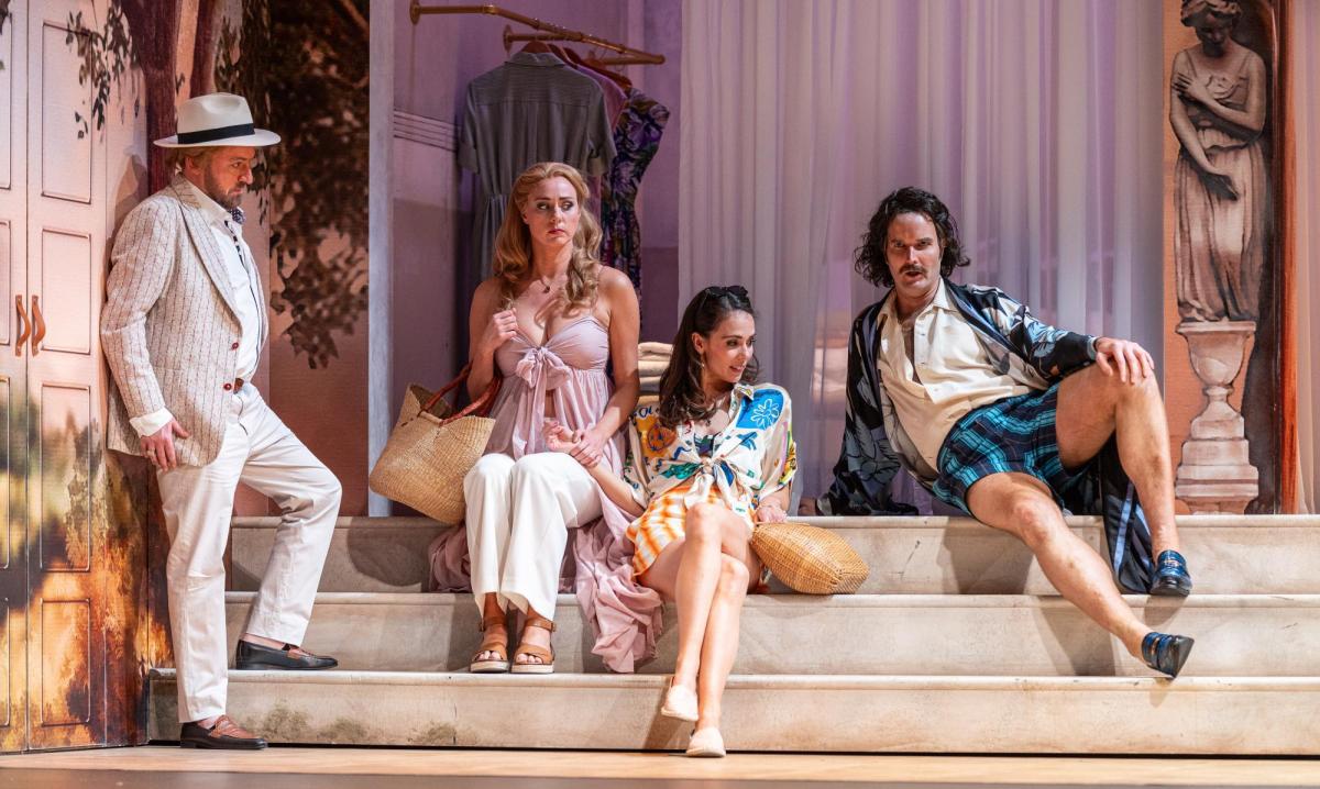 Christopher Hillier, Sky Ingram, Anna Dowsley and Nicholas Lester in modern resort lounge gear sitting and standing on steps on production of Così fan tutte.