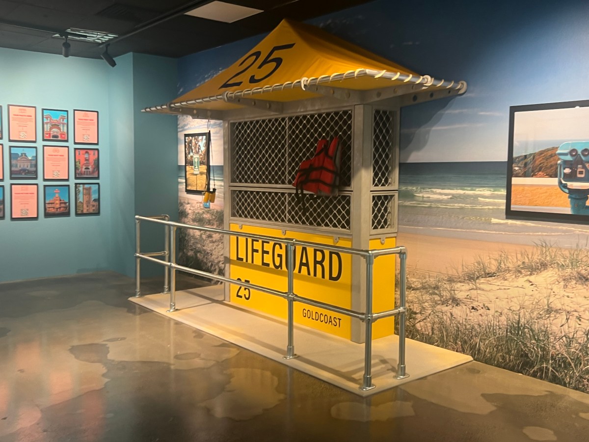 a vintage yellow lifeguard stand in an exhibition 'Accidentally Wes Anderson'