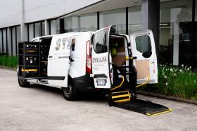 Accessible Makervan that won at the 2024 Australian Good Design Awards. A photo of a white van with the words STEAM visible on its side and back. The doors are open to show are elements can be pulled out to provide access.