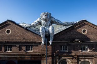 A giant gibbon installation on top of the roof of Carriageworks.