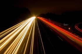 Arts sector comings and goings are covered in our On the Move column. Car headlights and tail-lights form lines of light in a long exposure photo of a highway at night.