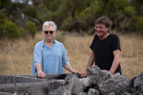 Two people standing in the country. Lesley Forwood and James Darling.