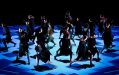 NAISDA students performing in 'ATI', Carriageworks, Jly2023. Dancers on stage illuminated by blue light from the floor. They are all in a lunging stance.