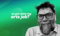 Shane Grant, La Mama Theatre’s acting Venue and Technical Manager, discusses his role for the So you want my arts job? series. A dark-haired, middle-aged and fair-skinned man with a greying beard and glasses smiles for the camera against a green background.