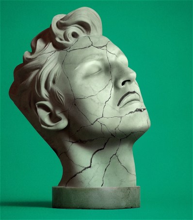 Agains a green backdrop, a bust of a man's head. It is cracked.