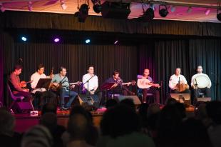 Eight musicians on stage at the Second Iranian Music Festival.