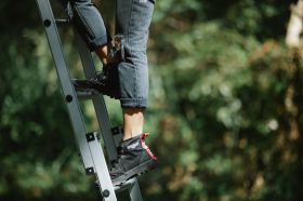 On the Move is ArtsHub's weekly round-up of Australian arts sector appointments and resignations. The photo shows someone climbing a ladder, with the focus tightly on their feet and the ladder's metal rungs.