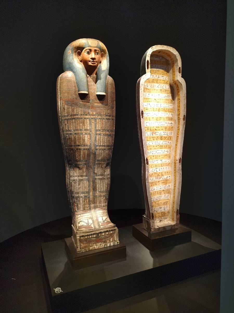 an Egyptian sarcophagus in a black room