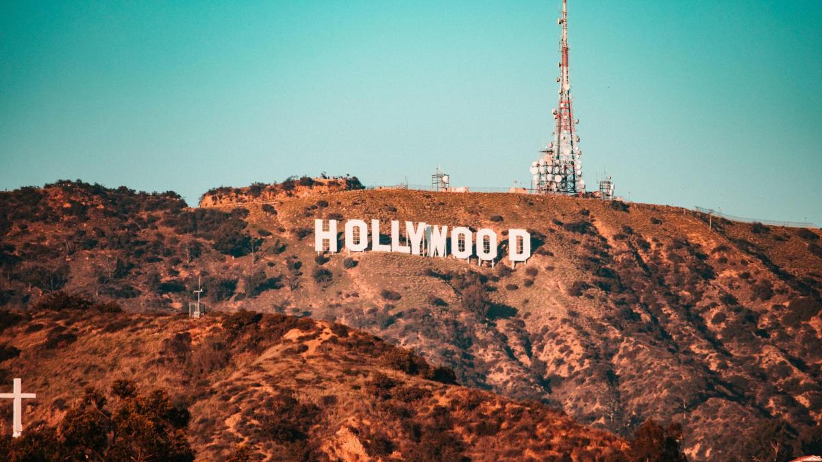 a colour photo of the Hollywood sign on the hill in California