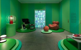 'Molto Bello: Icons of Modern Italian Design', installation view at Heide Museum of Modern Art. Furniture and lighting displayed inside a gallery with alternating shades of green wallpaper.