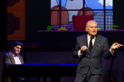 Two men. One is standing (Drew Forsythe), one is seated at a piano (Phil Scott) in a production of 'The End of the Wharf as we know it.'