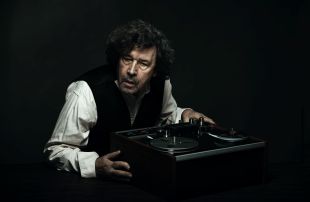 Stephen Rea in 'Krapp's Last Tape', one of many international productions in the 2025 Adelaide Festival. The lugubrious, lined, character-rich face of Irish actor Stephen Rea, who sits at a table bearing an old-fashioned reel-to-reel tape recorder.