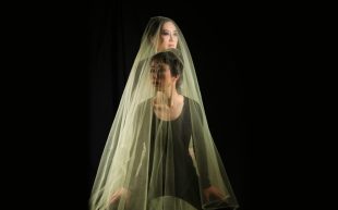 Art Music Fund 2025 open for applications. Image: Mindy Meng Wang and Monica Lim. Two woman with black hair and pale skin under a white veil against a black background.