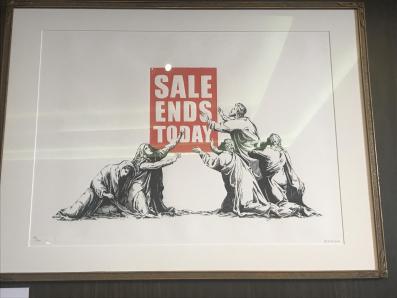 A print of four apostles worshipping a 'Sale Ends Today sign i n red and white by Banksy.