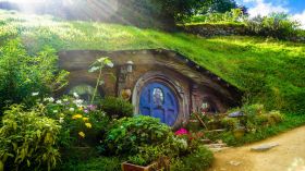 'The Lord of the Rings' films were filmed in Aotearoa New Zealand and are known internationally. Could a new cultural policy similarly amplify NZ's rich cultural sector? Photo depicts a hillside-set door in the movie set of Hobbiton.