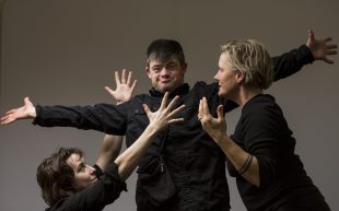 Second Echo Ensemble artists Bella Young, William Webster and Creative Director Kelly Drummond Cawthon. Young and Cawthon, two Caucasian woman, surround Webster, a man with his arms outstretched. Storytelling.