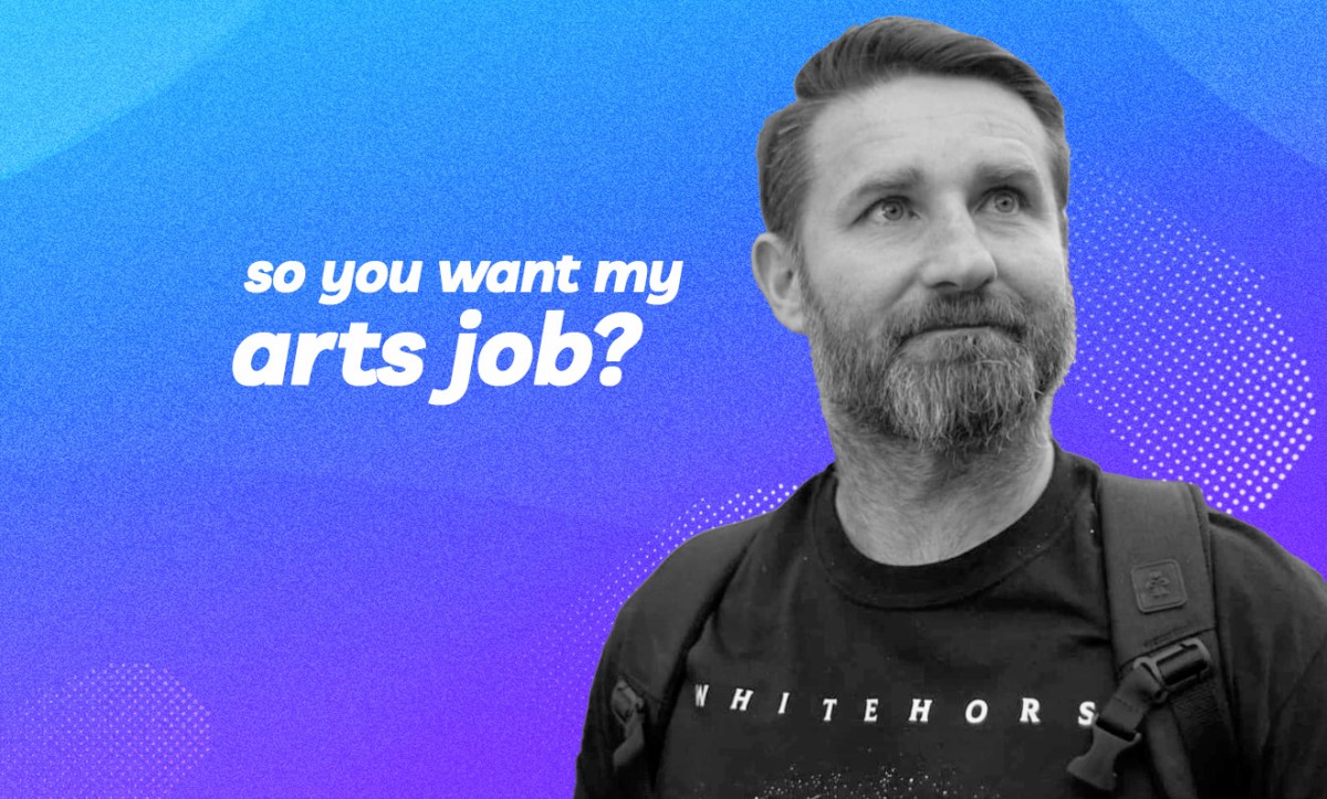 A black and white photo of Christian, a middle-aged Caucasian man with shortly cropped hair and trimmed beard, looking to the upper right hand side. It’s digitally rendered with a gradient blue purple background and the text ‘So you want my arts job?’