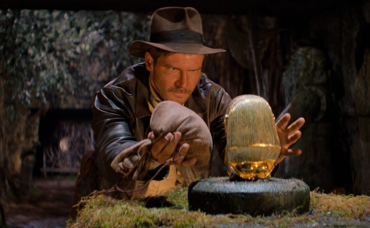 Harrison Ford as Indiana Jones about to bag a golden relic.