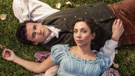 A new adaptation of Jane Austen's Pride and Prejudice opens Queensland Theatre's 2025 season. Image is a man and a woman in regency dress lying on the grass and looking up at the camera.