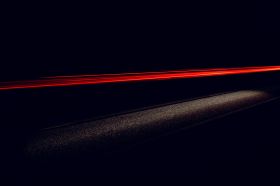 On the Move is ArtsHub’s weekly round-up of Australian arts sector appointments, comings and goings. The photo is a dramatic depiction of a road at night with trails of red light caused by a car's tail lights.