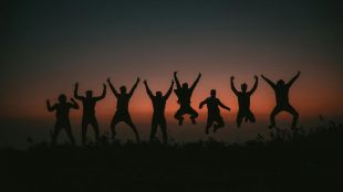 On the Move is ArtsHub's weekly wrap of Australian arts sector appointments and departures. The photo shows six people silhouetted against a sunset; they are all leaping joyously into the air, their arms raised above their heads triumphantly.