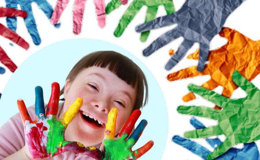 A smiling girl with paint on her hands. Around her are other painted hands.