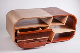 Modern coffee table made from wood in gallery setting. Top Designs