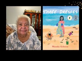 An elderly Indigenous woman wearing a grey and white patterned top. On the right is the cover of her book,' Three Dresses' which shows an illustration of a girl wearing a pink dress holding up a blue dress. She's on the beach with a small campsite fire lit nearby.